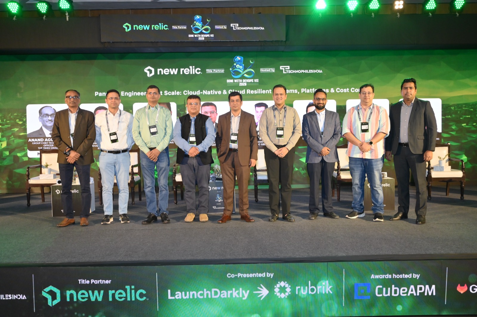 Panelists group photo on stage at Dine With DevOps, presented by New Relic